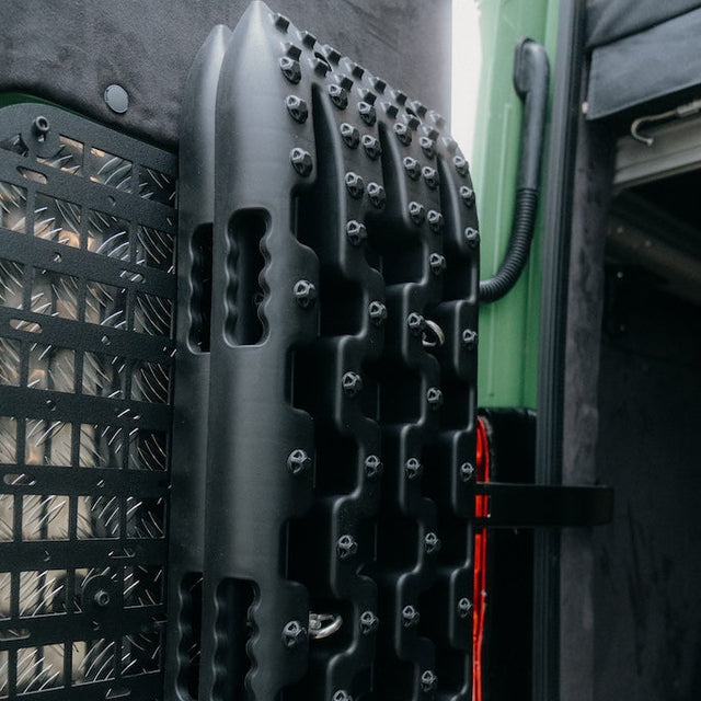 Recovery tracks mounted on MOLLE panel