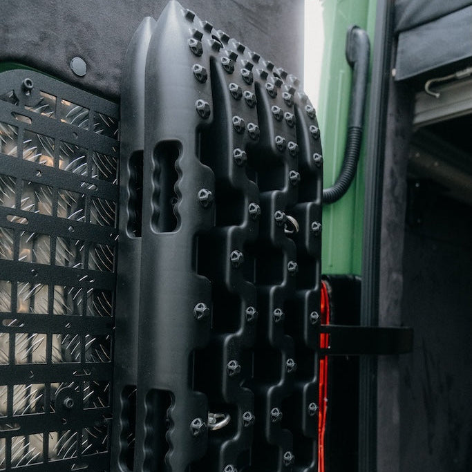 Recovery tracks mounted on MOLLE panel