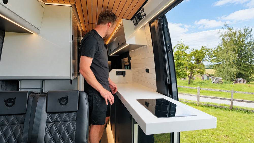 Campervan interior with seating and a fold-out table
